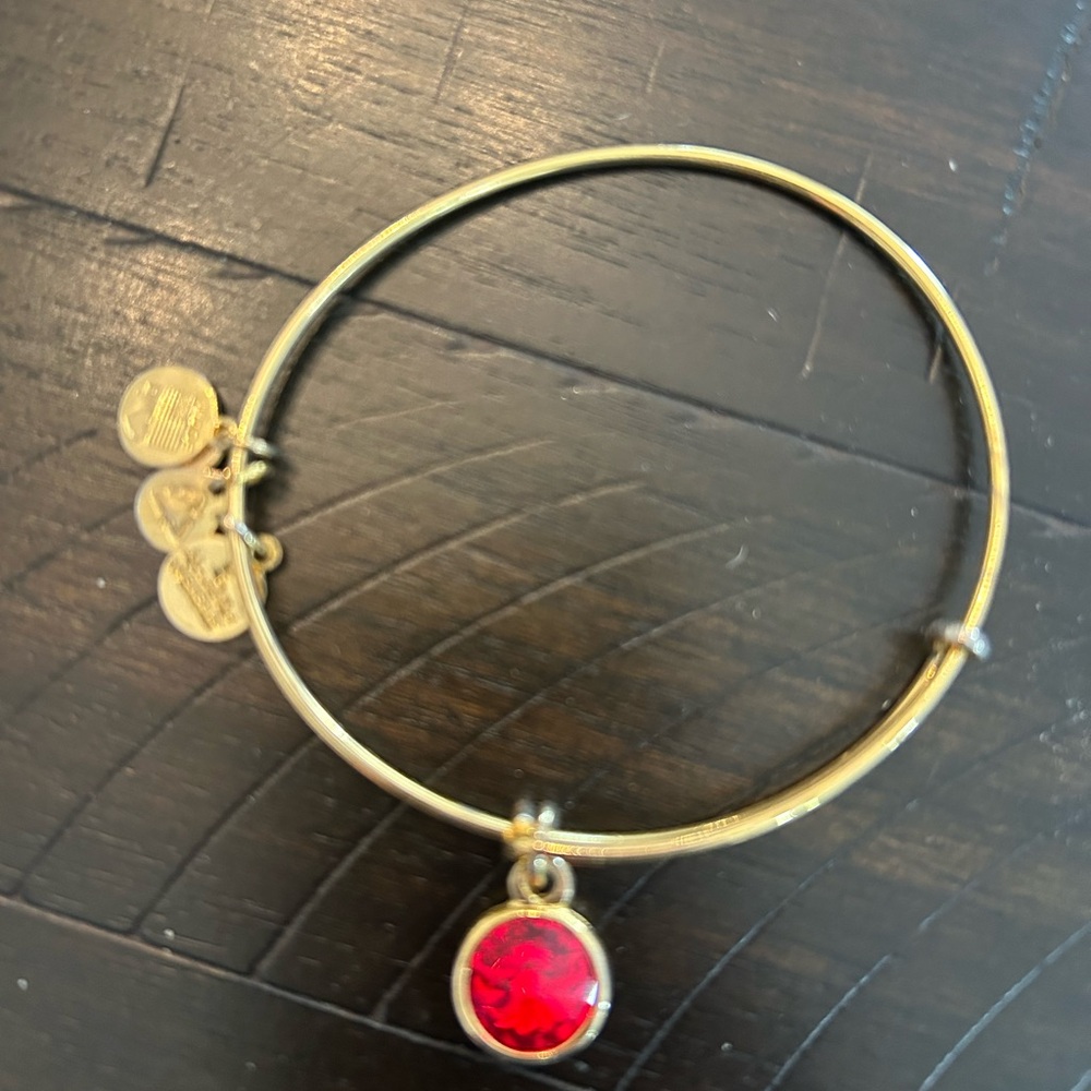 Alex and Ani Gold-Tone Bangle Bracelet with Red Gem Charm - Birthstone Bangle